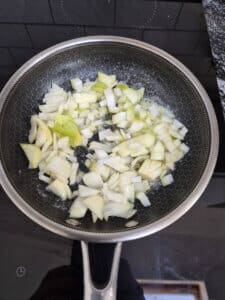 Soften onions with butter