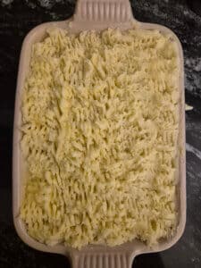 Fluff up the potato topping with a fork