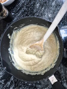 Adding the cheese sauce