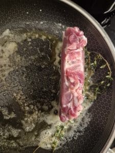 Stand the chop fat side down to render the fat