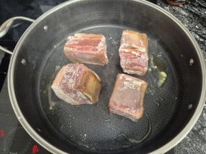 Browning the short ribs