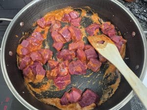 browning the beef in massaman paste 