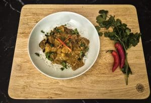 Serve with red chilli slices and coriander