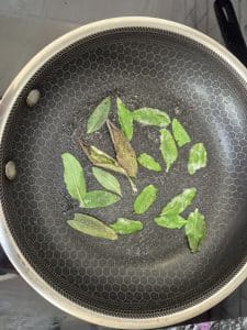 Gently fry off the sage leaves