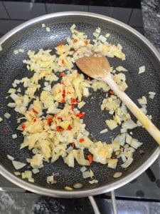 Onions, garlic, ginger and chilli in a pan