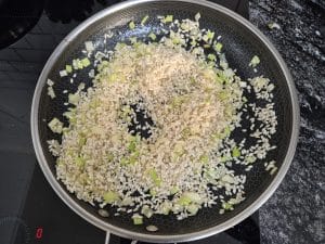 Toast rice in the pan with celery & onion