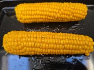 Brush the chipotle honey all over each cob before grilling