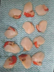 Dry the scallops and season before frying