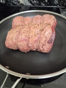 Beef searing in the pan before roasting