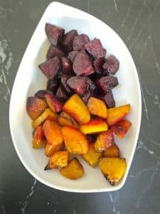 Roasted beetroot in a white serving dish