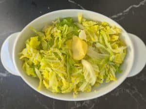 Buttered Savoy cabbage in a white bowl