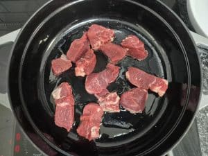 searing the beef in the pan